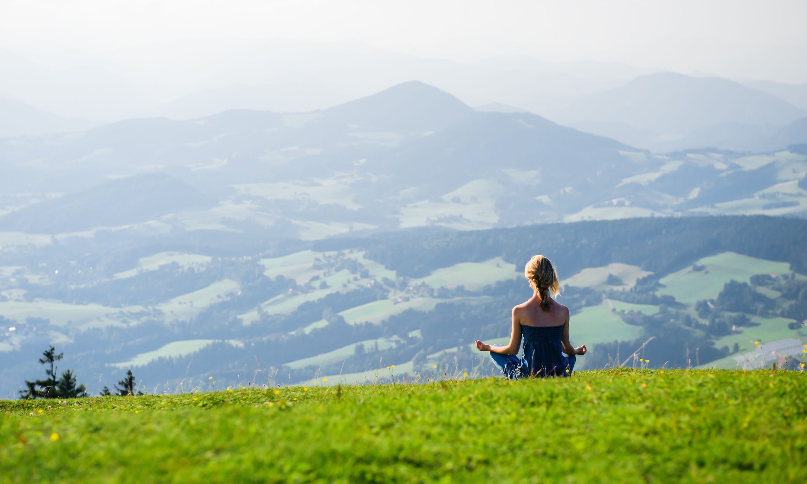 15026842 – young woman meditating outdoors